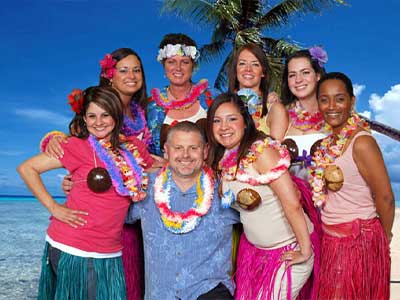 Attendees posing against a custom green screen backdrop at a corporate event, captured by Christie’s Photographic Solutions.