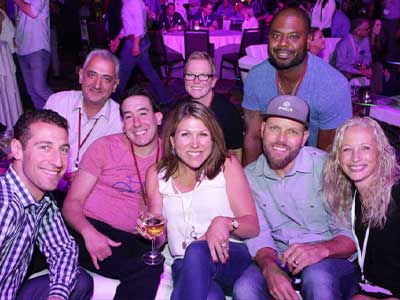 Elegant corporate event slideshow presentation with ambient lighting, captured by Christie’s Photographic Solutions.