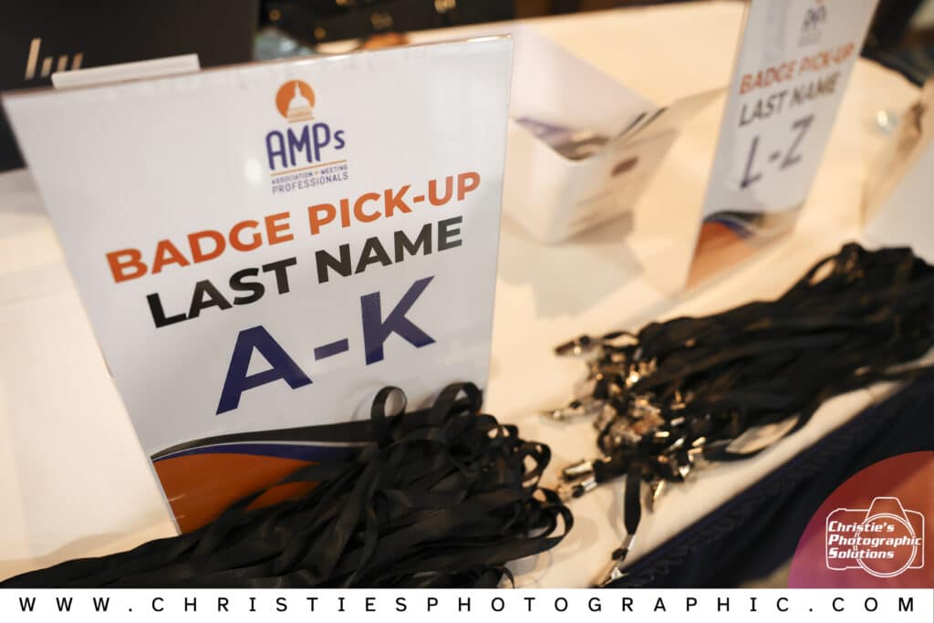 Event badge pickup at a professional event captured by Christie's Photographic Solutions.