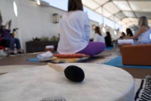Sound healing instrument and attendees seated during a corporate wellness session, captured by Christie’s Photographic Solutions.